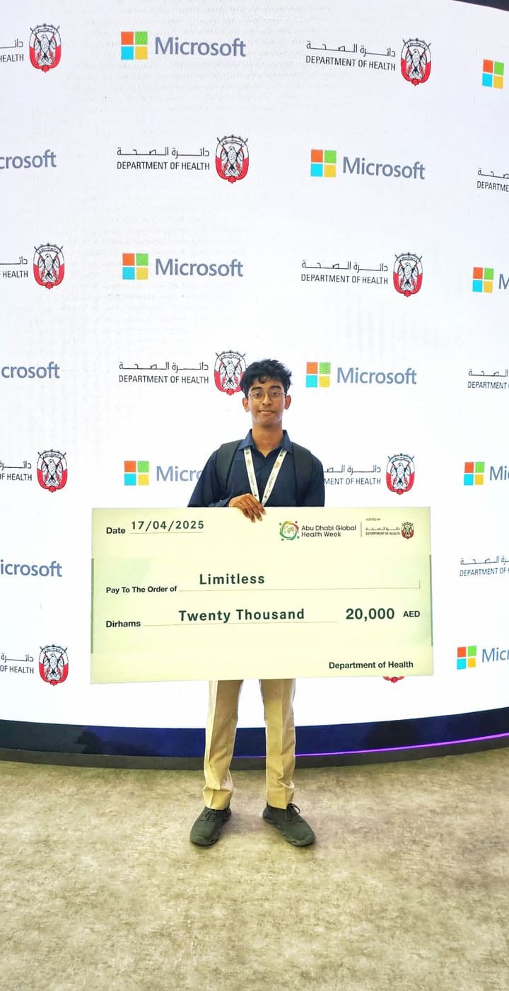 A presentation cheque for twenty thousand dirhams dated 17 April 2025, held up in front of a Department of Health and Microsoft backdrop.